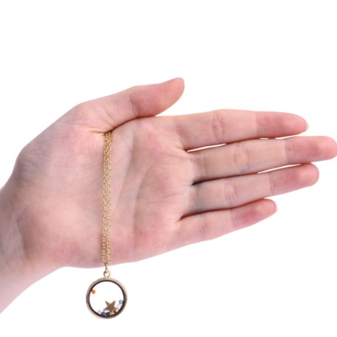 18 inch gold plated necklace. Floating chakra beads with star