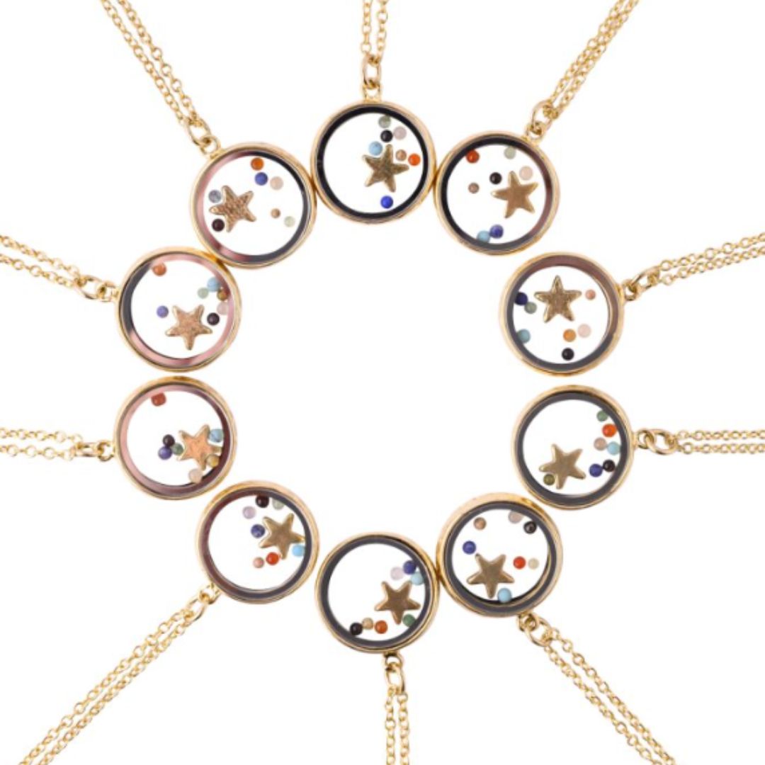 Gold necklaces with circular pendants featuring star designs on a white background