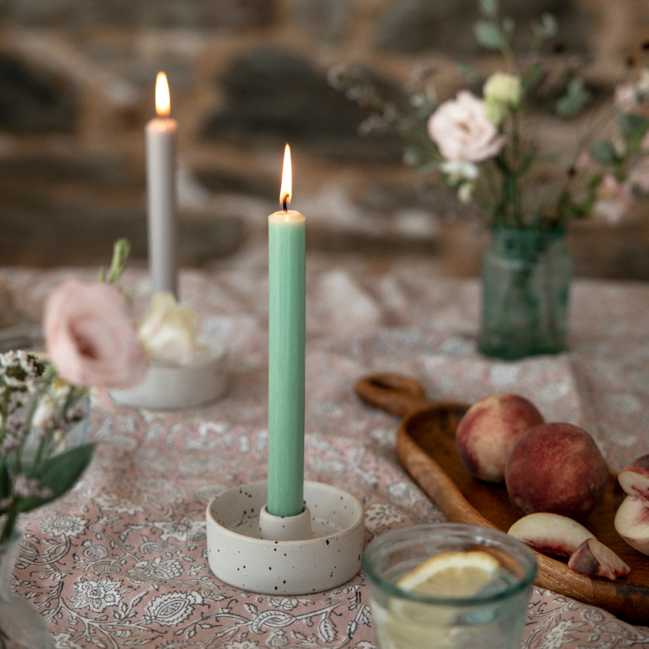 Elegant Dinner Candle setting for a rustic wedding or table setting with pink peony and pale pink roses in jar