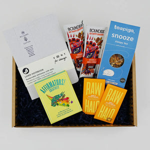 Exam Care Package containing notebook, snacks, tea and affirmations cards